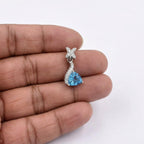 Sterling Silver Blue Topaz Wave Pendant – Diamond Star Accents, Minimalist Sky Blue Necklace